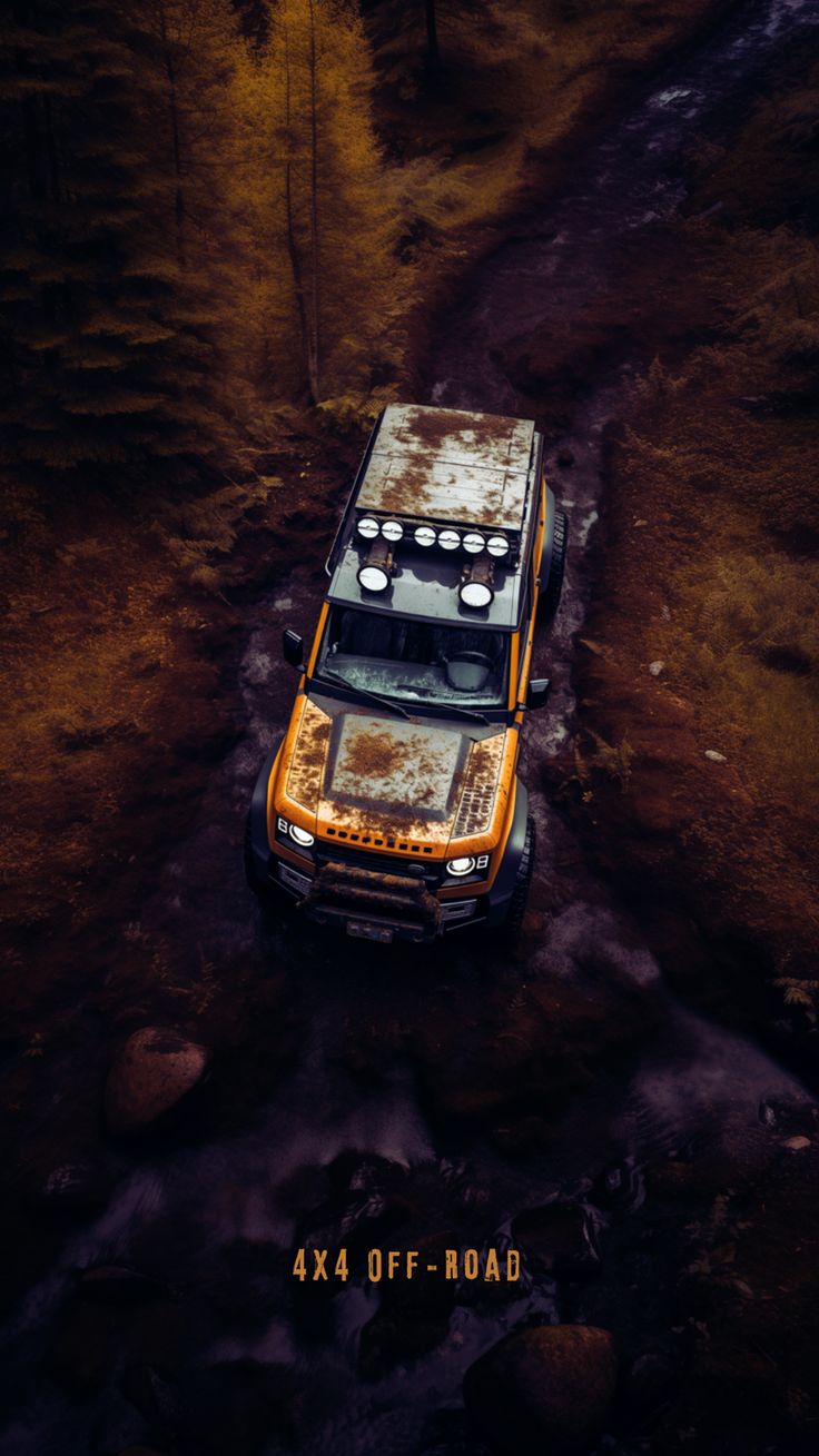 an orange truck is parked in the mud