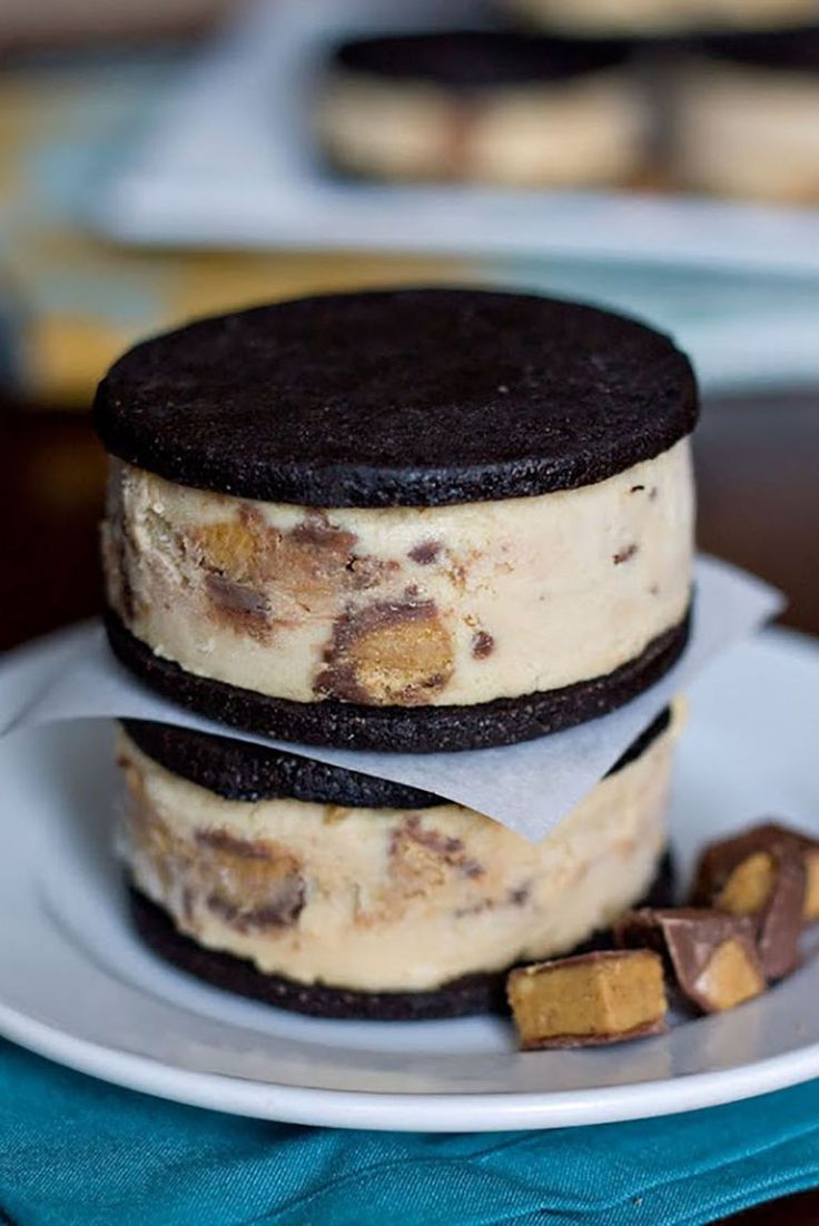 two cookies and oreo cookie sandwiches on a plate