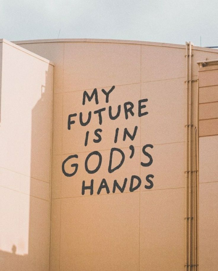 graffiti on the side of a building that says my future is in god's hands