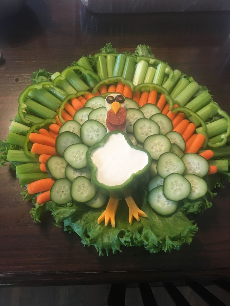 a turkey made out of cucumbers, carrots and celery