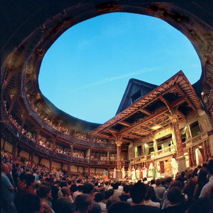 an image of a theatre scene taken from inside the auditorium looking into the audience and stage