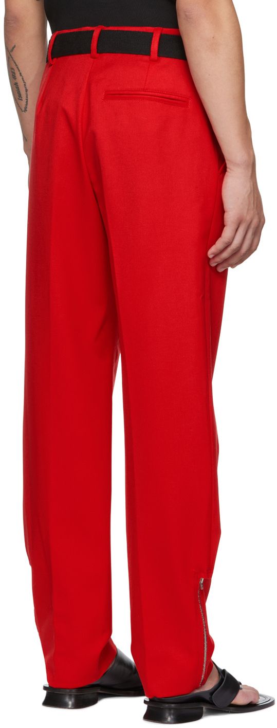 Wool delaine trousers. · Belt loops · Three-pocket styling · Zip-fly · Central crease at front and back legs · Zip vent at cuffs Supplier color: Red Red Tapered Leg Pants For Formal Occasions, Red Formal Bottoms With Welt Pockets, Formal Red Bottoms With Welt Pockets, Red Trousers With Pockets, Red Workwear Pants With Welt Pockets, Red Work Pants With Welt Pockets, Red Trousers With Welt Pockets, Red Straight Leg Pants With Welt Pockets, Straight Leg Trousers