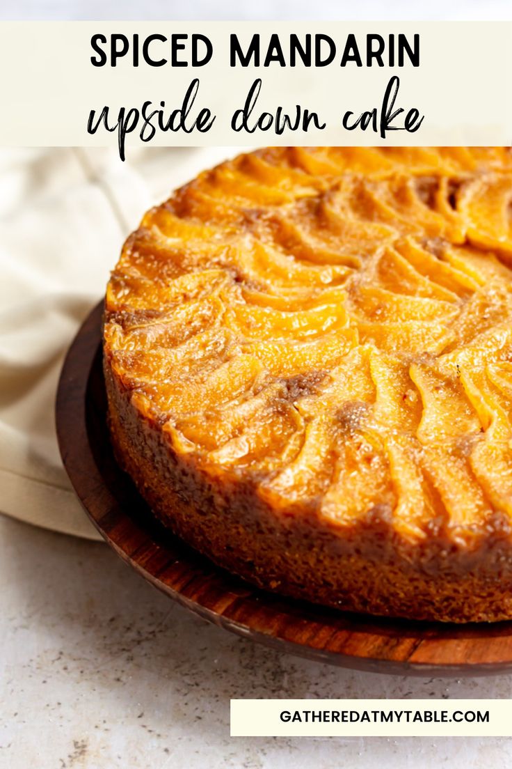 a close up of a cake on a plate with the words spiced mandarin upside down cake