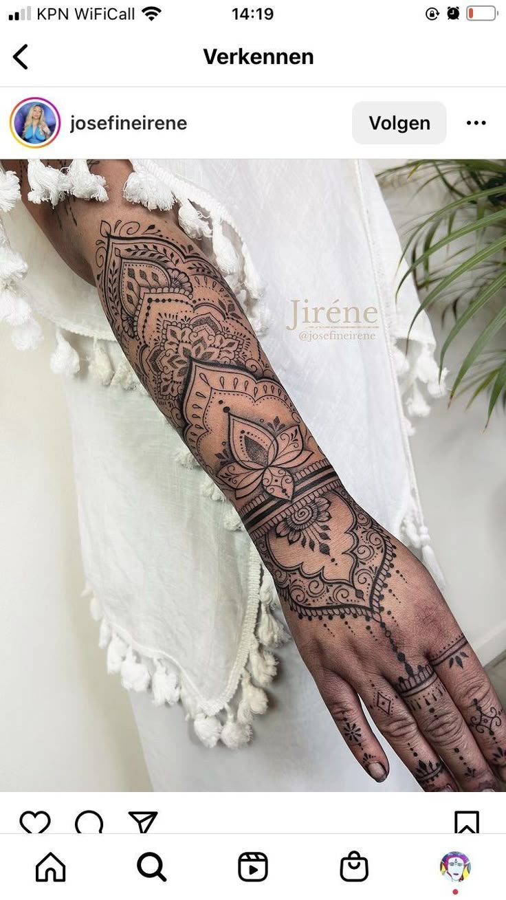 a woman's hand with henna tattoos on her left arm and the words, i