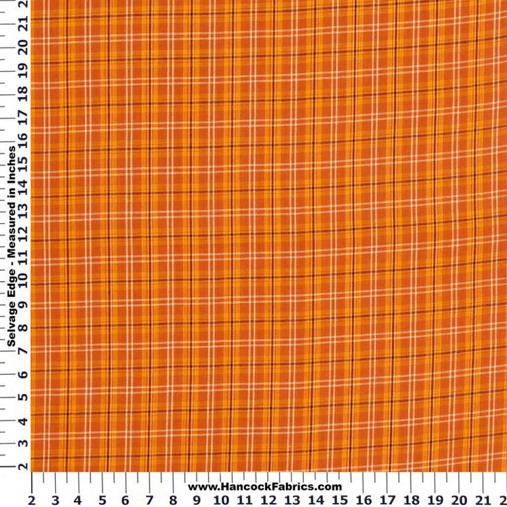 an orange and yellow plaid fabric is shown with a ruler in front of the image