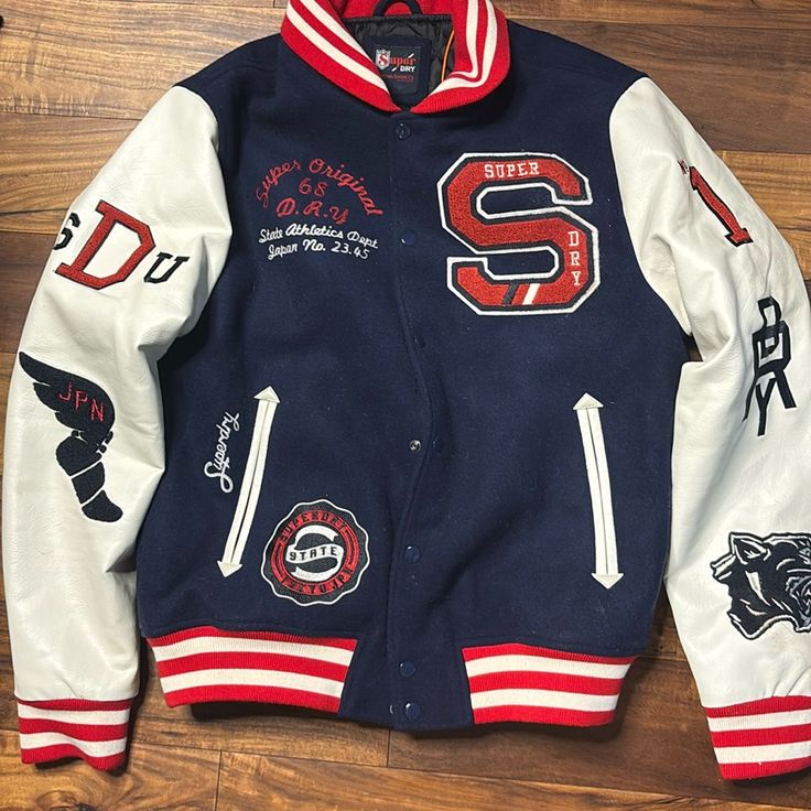 Brand New With Tags Us Size Xl From Superdry In Boston Brand New Perfect Condition Collegiate Blue Cotton Outerwear, Navy Varsity Hooded Outerwear, Red Sporty Varsity Jacket With Pockets, Navy Hooded Varsity Outerwear, Red Varsity Sports Outerwear, Navy Collegiate Outerwear For Sports Events, Collegiate Blue Long Sleeve Outerwear, Cotton Sportswear For Sports Events, Navy Hooded Outerwear For College