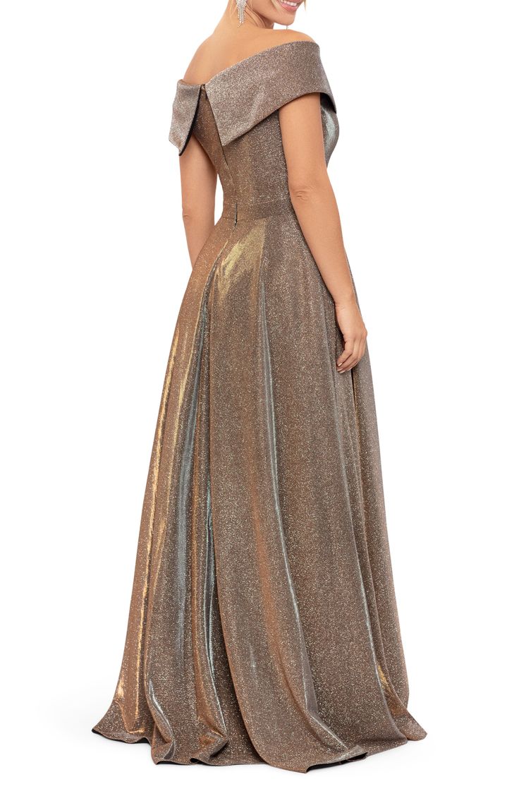 Enchant at your next soirée in an elegant off-the-shoulder gown designed with a long, sweeping skirt in shimmering, sparkle-flecked fabric. 52" Center Front Length (Size 8) Off-the-shoulder neck Cap sleeves Lined 100% polyester Spot clean Imported Glitter Dress Long, Champagne Evening Gown, Glitter Gown, Xscape Dresses, Flare Gown, Glitter Dress, Gowns Online, Gowns With Sleeves, Review Dresses