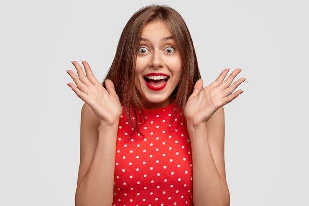 a woman with her hands up in front of her face and the words shutterstock com