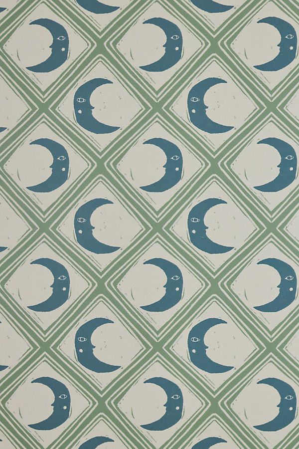 an image of a blue and green wallpaper with the moon on it's side