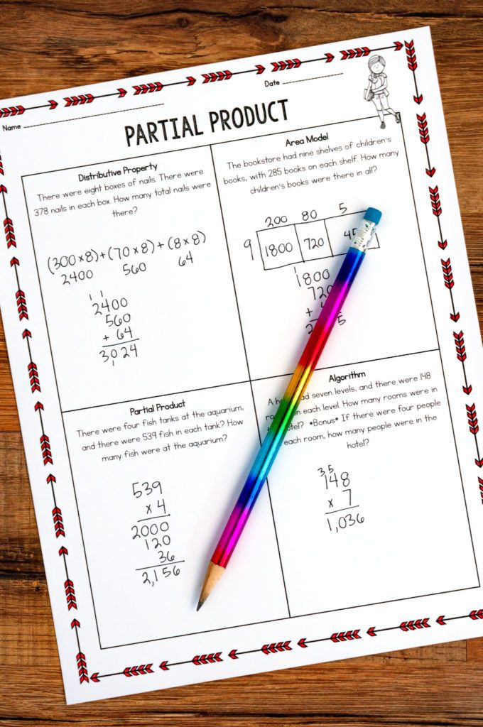 a colorful pencil sitting on top of a piece of paper next to a calculator