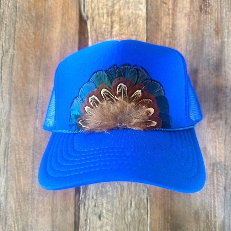 Adorable Royal Blue Trucker Hat With Feathers Blue Casual Mini Hat With Adjustable Fit, Casual Blue Mini Hat With Adjustable Fit, Casual Blue Adjustable Mini Hat, Blue Adjustable Trucker Hat With Short Brim, Blue Short Brim Hat For Fall, Blue Fedora Hat One Size Fits Most, Blue Brimmed Hat For Festival, Blue Snapback Hats For Spring, Blue Festival Hats, One Size Fits Most