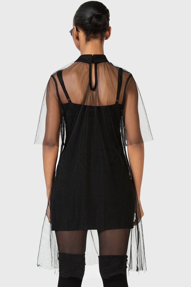 RAVAGED SPIRIT.- Statement mesh dress- Included stretch slip dress.- High neckline.- Short sleeves.- Mini length.With KIHILIST branding, Fabric 1: 100% Polyamide, Fabric 2: 95% Viscose, 5% Elastane.Hand wash cold (30°c) / Do not bleach / Do not tumble dry / Iron at low temperature / Do not dry clean. Imported. Sheer Bodice Mesh Mini Dress For Evening, Evening Mini Dress With Sheer Mesh Bodice, Summer Dress With Stretch Sheer Bodice, Summer Stretch Nylon Dresses, Sheer Mesh Dress For Spring Evenings, Spring Evening Sheer Mesh Dress, Evening Dresses With Sheer Sleeves In Nylon, Black Nylon Mesh Dress For Evening, Black Mini Dress With Sheer Bodice For Summer