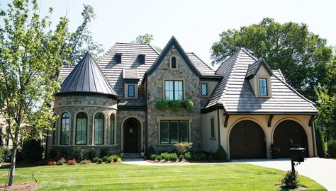 a large house with lots of windows in the front yard