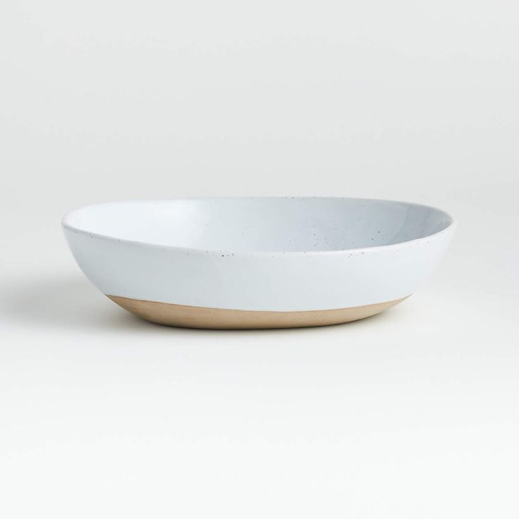 a white bowl sitting on top of a table