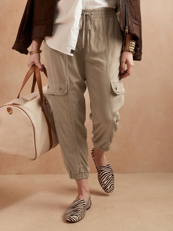 Inspired by a pair from our archives, this sumptuously soft cargo pant draws on our legacy of innovation, combining utilitarian styling with thoroughly modern fabric.  TAPERED FIT: Expertly cut for a slim, not-too-tapered fit.  SUSTAINABILITY: Made w Casual Travel Pants With Pockets, Everyday Parachute Pants With Side Pockets For Spring, Chic Ankle-length Cargo Parachute Pants, Spring Trendy Cargo Pants For Elevated Casual Look, Utility Style Everyday Cargo Pants For Spring, Trendy Tapered Leg Parachute Pants For Work, Utility Cargo Pants For Everyday Spring Wear, Trendy Fall Cargo Pants For Elevated Casual Wear, Utility Cargo Pants For Spring Workwear