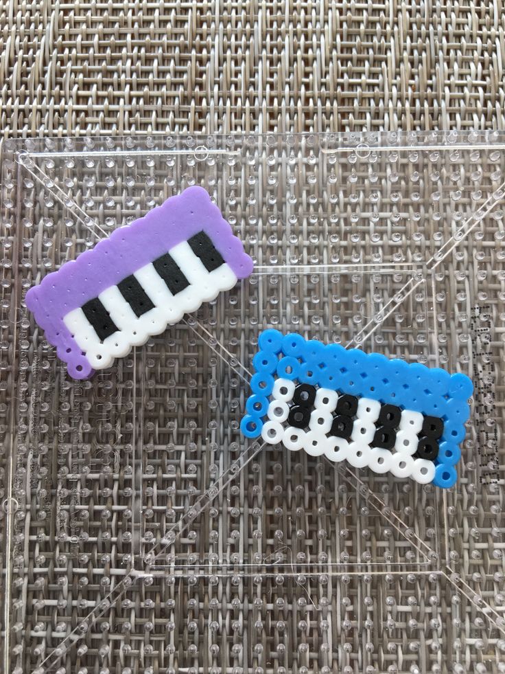 two legos made to look like they are playing the piano game on their own