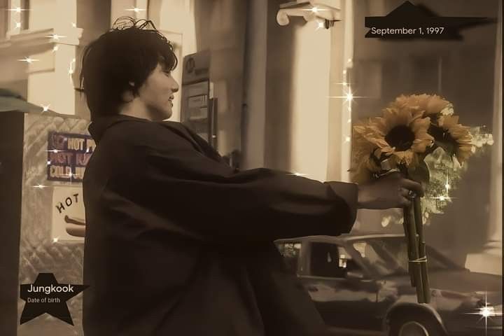 a man is holding a bouquet of sunflowers in front of a store window