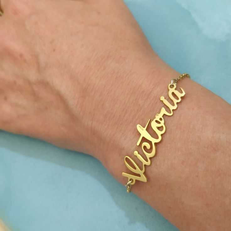 Personalized 14k - Name Bracelet - Solid Gold Bracelet - Custom Name Bracelet - Name Jewelry - Christmas Gift - Personalized Gift - Victoria . . . . . . . . . . . . . . . . . . . . . . . . . . . . . . . . . . . . . . . . . . . . . . . . . . . . . . . . . . . Looking for a thoughtful gift for your loved one? You will love this high quality Personalized 14k Name Bracelet. This is a perfect gift for your girlfriend or wife. This lovely Personalized 14k Solid Gold Name Bracelet is made to order. Pur Gold Charm Bracelet Gift, Classic Gold Bracelets For Valentine's Day, 14k Gold Name Bracelet Jewelry, 14k Gold Charm Bracelet For Gift, 14k Gold Charm Bracelet Gift, Gold 14k Charm Bracelet Gift, Classic Gold Name Bracelet For Mother's Day, Personalized Yellow Gold Jewelry With Jubilee Bracelet, Elegant Customized 14k Gold Name Bracelet