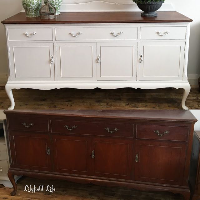 a white dresser with two vases on top of it