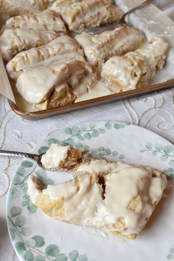 a plate that has some kind of pastry on it and another plate with one slice