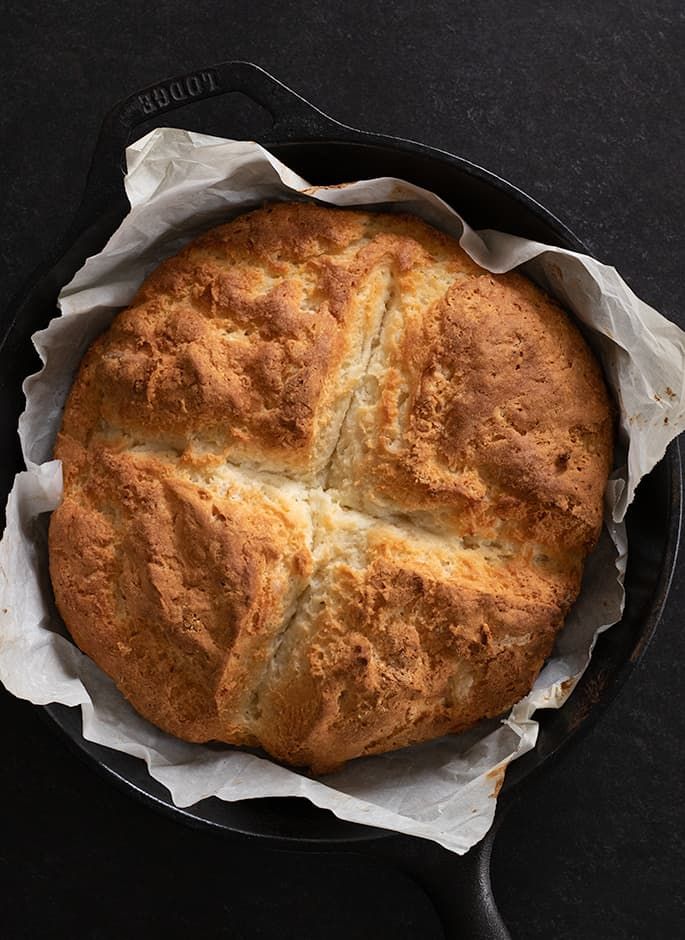 a freshly baked bread in a cast iron skillet