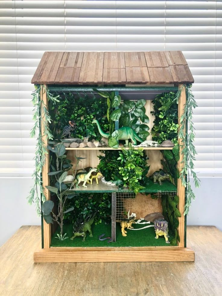 a wooden shelf filled with fake plants and animals