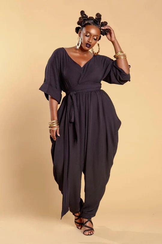 JIBRI V Neck Slouch Jumpsuit w Cuffs V Neck Gathered Waist Cuffs Permanent Cuff Tabs with mini gold button Attached Wrap Belt Relaxed fit Exaggerated hip drape Chic side pockets Invisible back zipper Fabrication: Crepe Sizing: True to Size  (View Size Chart) Handmade in Atlanta, GA Style Notes: Perfect for all seasons. Feminine Summer Outfits, Balloon Pants, Perfect Summer Outfit, Stylish Summer Outfits, Mini Gold, Wrap Belt, Plus Size Jumpsuit, Atlanta Ga, Modern Fashion