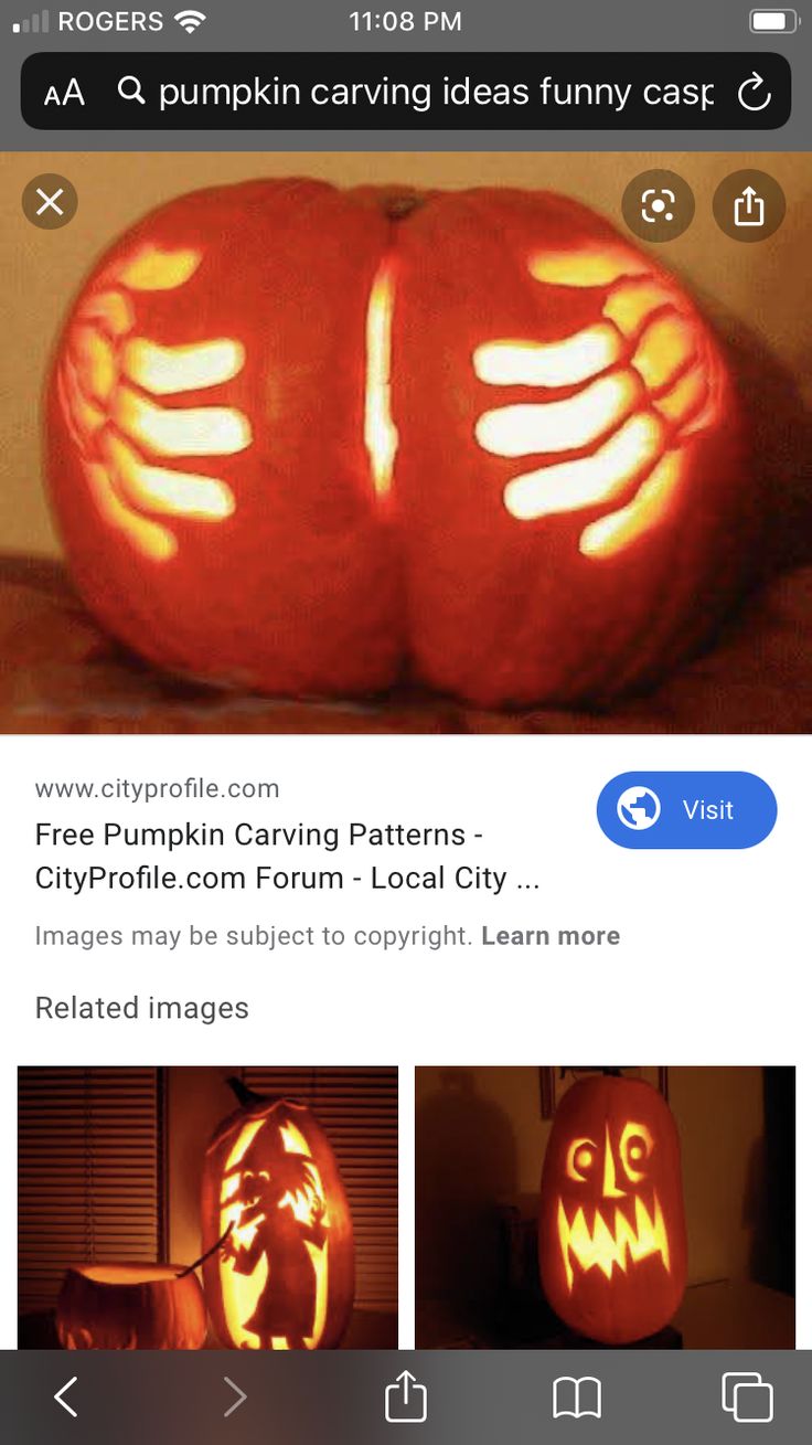 two pumpkins carved to look like hands and feet with glowing lights on their faces