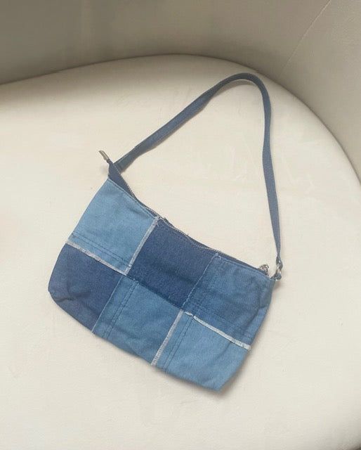 Our stylish Melanie denim patchwork handbag is sure to be a spring favorite! Approx Measurements: 9x5 in Materials: Denim Trendy Patchwork Shoulder Bag For Everyday Use, Trendy Rectangular Patchwork Shoulder Bag, Trendy Patchwork Bags For Everyday Use, Daily Use Fabric Shoulder Bag With Patchwork, Casual Patchwork Shoulder Bag, Casual Rectangular Patchwork Bag, Blue Square Denim Bag, Blue Patchwork Shoulder Bag For Everyday Use, Blue Patchwork Bag