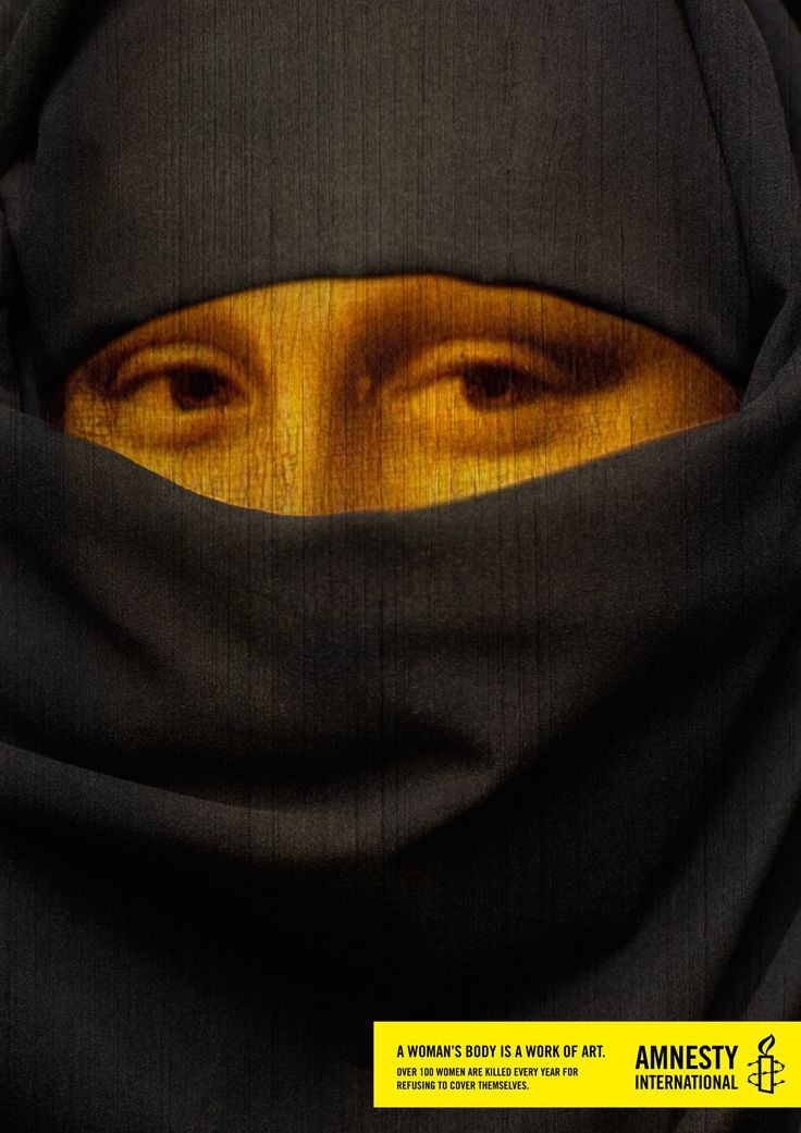 a woman wearing a black hijab and looking at the camera with an intense look on her face