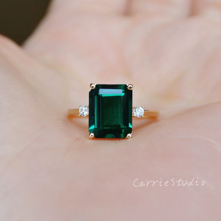 Solid 14K gold Emerald Ring, this beautiful emerald ring use a 8*10mm lab created emerald in the middle, with two round white stone and one marquise stone on each side, elegant and simple style, suit for all different occasion, it's a great gift for someone you loved or yourself, we also will provide a beautiful ring box. ❥Details: Material: Solid 14K Gold, 3 color for choice, 14KW(white gold), 14KY(yellow gold), 14KR(rose gold) Main Stone: Real Lab Created Emerald Dimension: 8*10 mm, about 3-3. Emerald Rings Design, Modern Emerald Ring, Emerald Solitaire Jewelry For Proposal, Radiant Cut Emerald Ring In Fine Jewelry, Emerald Jewelry With Accent Stones For Proposal, Emerald Cut May Birthstone Jewelry For Proposal, Emerald Cut Emerald Proposal Ring, Emerald Ring For Proposal In Fine Jewelry Style, Emerald Ring For Proposal