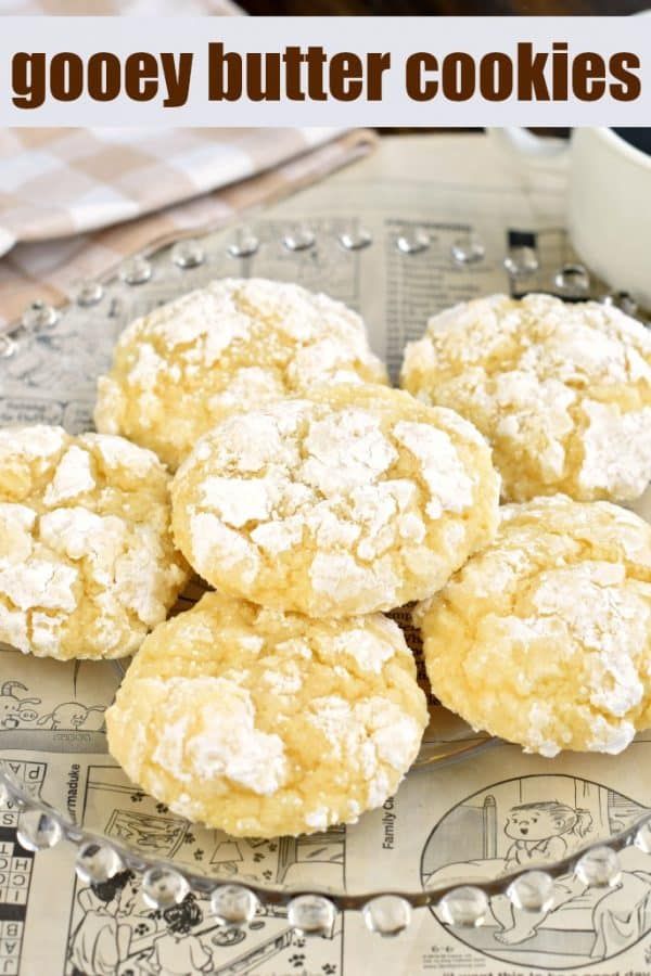 some cookies are sitting on a plate with the words gooey butter cookies