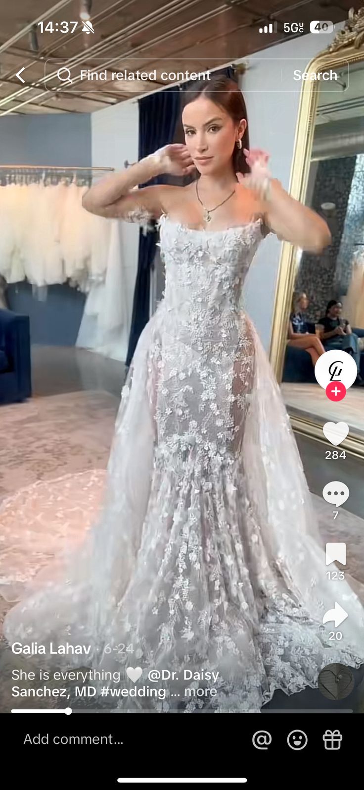 a woman in a wedding dress is taking a selfie