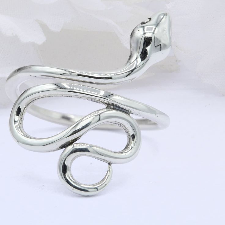 "Item Specifications: ☉ Metal Type: Sterling Silver. ☉ Metal Stamp or Hallmark: .925 ☉ Metal Purity: 92.5% Sterling. ☉ Face Measurements From South To North: 23mm(0.90\") Custom orders welcome!" Fine Jewelry Silver Snake-shaped Ring, Fine Jewelry Silver Snake Shape Ring, Silver Snake Shape Fine Jewelry Ring, Elegant Silver Snake-shaped Ring, Adjustable Nickel-free Sterling Silver Snake Ring, Minimalist Adjustable Silver Snake Ring, Adjustable Silver Nickel-free Snake Ring, Adjustable Nickel-free Silver Snake Ring, Adjustable Silver Symbolic Midi Rings