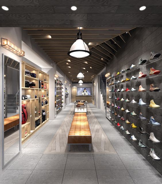 a large room with many shoes on the wall and shelves full of shoes in them