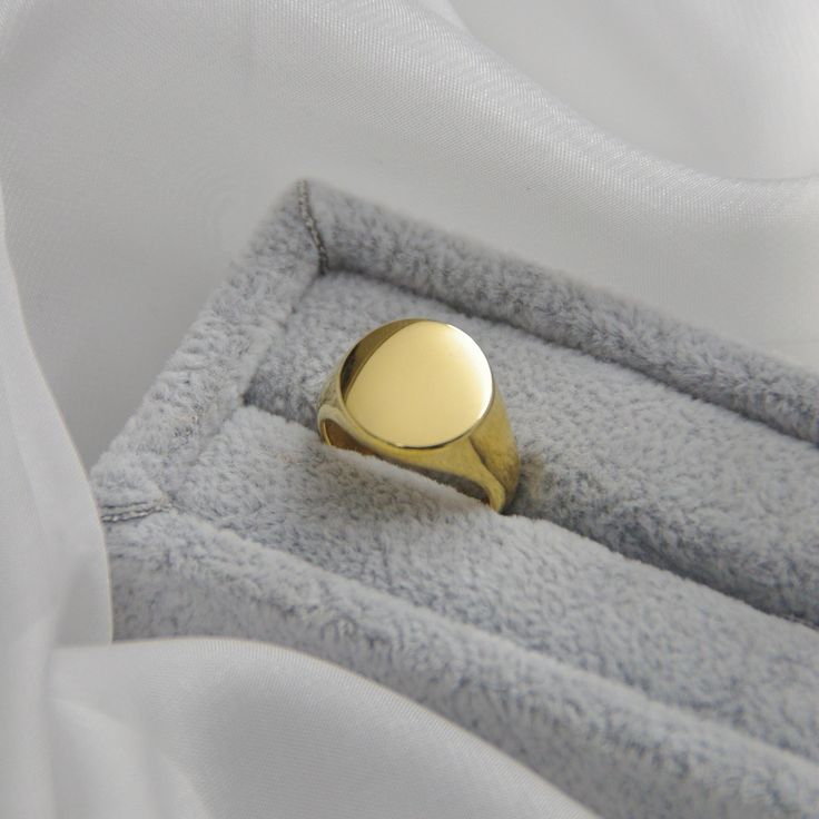 Circle Signet Rings14k Gold Plated Stainless SteelOur Signet Rings are the perfect marriage of elegance and charm. They make the perfect addition to any jewelry collection. These fashionable accessories are minimalist in make, yet timeless in style. The base of each Signet Ring is made with 14k Gold Plated Stainless Steel, allowing them to keep their color over time. All of our pieces are made with lightweight and hypoallergenic materials, allowing for easy, comfortable, all day wear.If you love Simple Gold Engraved Ring For Anniversary, Simple Gold Engraved Promise Ring, Simple Gold Initial Ring For Anniversary, Gold Minimalist Initial Ring With Round Band, Simple Polished Open Ring Jewelry, Minimalist Gold Engraved Ring Tarnish Resistant, Wedding 14k Gold Signet Ring With Round Cut, Classic Formal Couple Rings Stamped 14k, Classic 14k Rose Gold Couple Rings