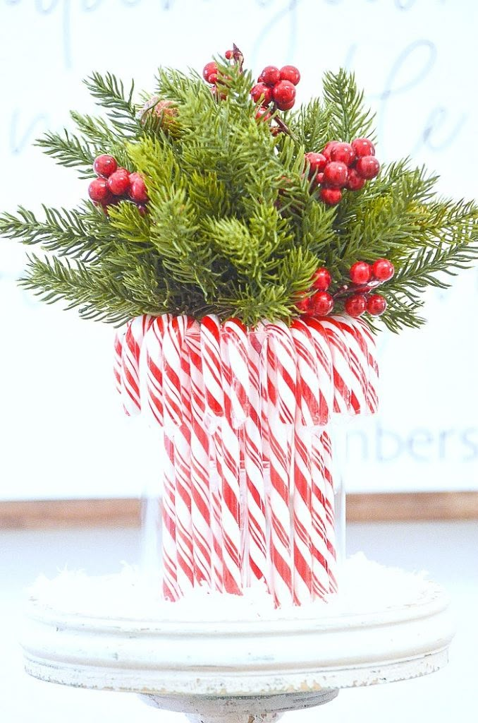 some candy canes are sitting in a vase