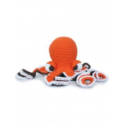 an orange and white crocheted octopus toy with its head on it's back