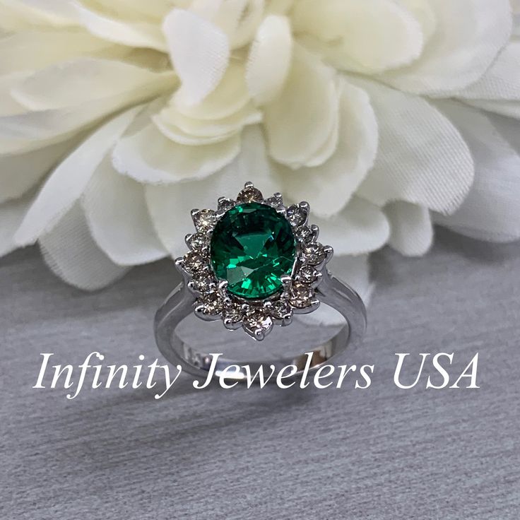 Emerald Halo Ring 14k White Gold, Vintage Emerald Engagement Ring, Oval Halo Ring With Emerald, May Birthstone Ring, Emerald Jewelry #6719 We feature the finest quality lab grown emeralds in the world. The properties of lab-grown are physically, chemically and visually identical to natural, just grown in a lab setting. Emerald is the birthstone of May -Approximate total carat weight: 2.50ctw diamond equivalent -Center Stone Size: 9x7mm approx. 2.10ct. diamond equivalent -Center Stone Shape: oval Oval Emerald Ring In 14k White Gold, Classic Halo Ring For Anniversary With May Birthstone, Gia Certified Oval Diamond Ring For Anniversary, Oval Halo Jewelry For Anniversary, Oval Halo Design Jewelry For Anniversary, May Birthstone Gemstone Halo Ring For Anniversary, Fine Jewelry Emerald Ring With Halo For Anniversary, Halo Ring With Prong Setting For Anniversary, Oval 14k White Gold Jewelry For Anniversary