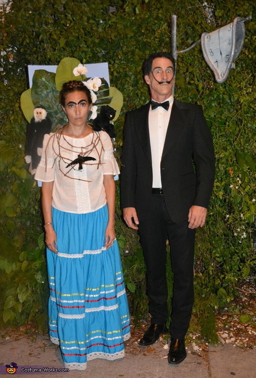 a man and woman dressed up in costume