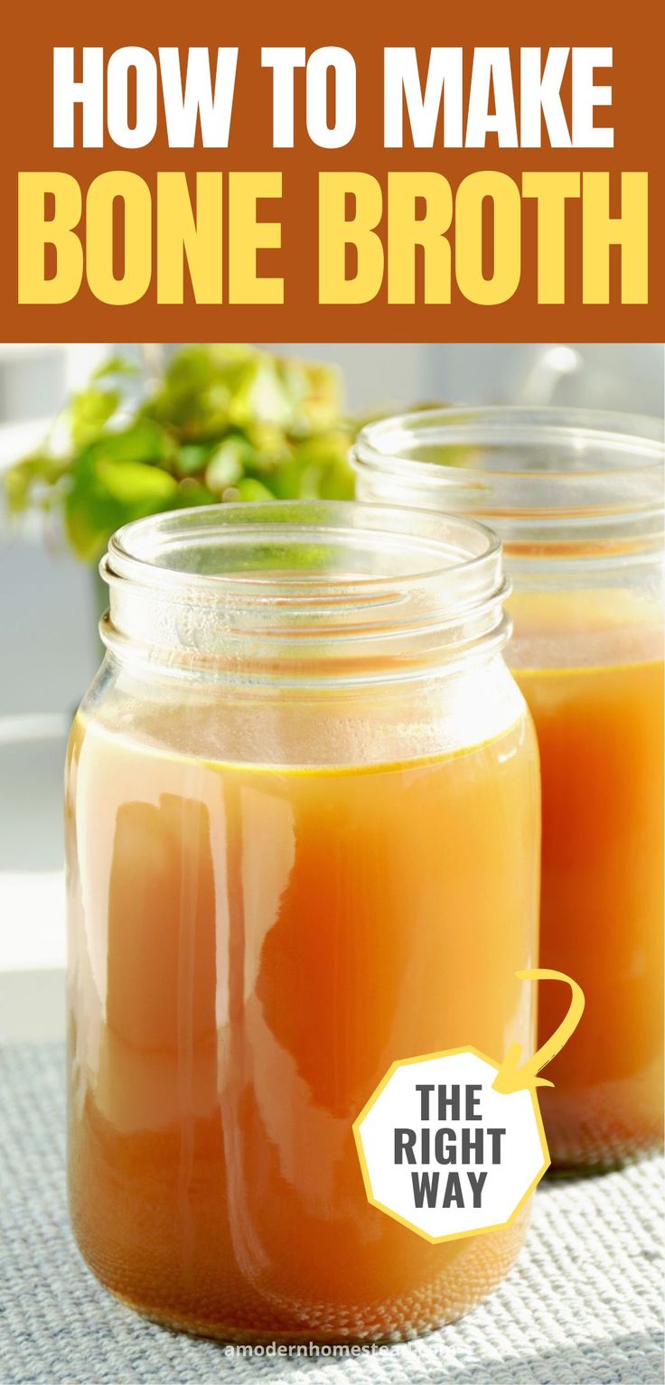 two jars filled with orange liquid sitting on top of a table next to each other