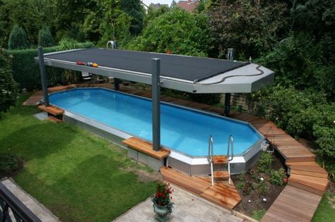 an above ground swimming pool surrounded by trees