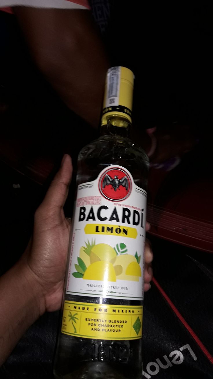 someone holding a bottle of bacardi lemonade