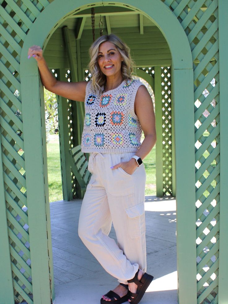 Be cool, fun and stylish with this adorable Crocheted Up knit tank crochet top. This versatile top can easily be dressed up or down, depending on your occasion. Featuring an intricate crochet knit, granny square pattern and colorful details, this trendy top will make you the envy of your crew - no joke! Granny Square Crochet Detail Tank Style Mom Crop Length Wide Strap Details Color May Vary From Different Viewing Devices Runs True to Size Amy is 5'4", 34B Wearing a Size Small Material and Care 60% Cotton | 40% Polyester Hand Wash Cold | Lay Flat to Dry Casual Spring Sweater Vest For Vacation, Casual Sweater Vest For Vacation In Spring, Casual Sweater Vest For Spring Vacation, Spring Vacation Knit Sweater Vest, Trendy Crochet Top With Crochet Trim, Trendy Crochet Knit Top For Spring, Casual Open Knit Cotton Tank Top, Crochet Knit Sweater Vest For Spring, Trendy Sleeveless Crochet Top For Day Out