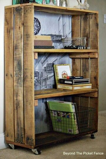 a wooden book shelf with baskets and books on top