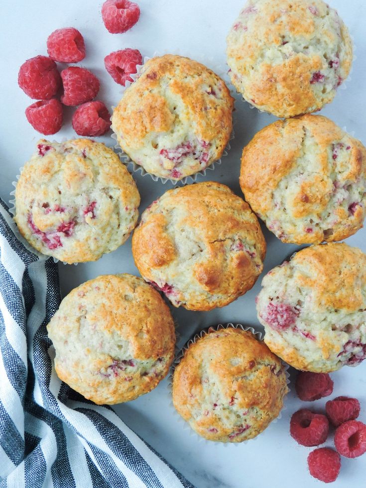 raspberry muffins with fresh raspberries on the side