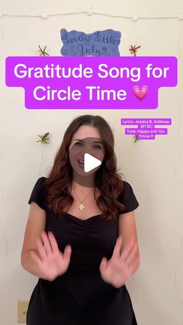 a woman standing in front of a sign with the words grateful song for circle time