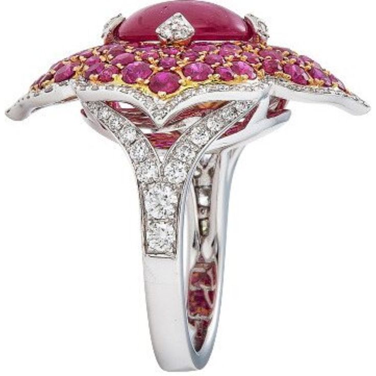 Imagine the feeling of pure luxury and elegance as you slip on the Pacha Ring in Ruby by Piranesi. With a stunning 3.71 carat cabochon ruby as the centerpiece, this ring exudes timeless beauty and sophistication. Surrounding the ruby are 2.91 carats of round rubies that complement the rich red color of the cabochon. To add a touch of sparkle and glamour, the ring is also adorned with 0.77 carats of round diamonds. The 18K white and rose gold setting enhances the natural beauty of the stones, cre Round Diamond Ring Set, Round Diamond Ring Settings, Cabochon Ruby, Contemporary Fine Jewelry, Bath And Body Works Perfume, Diamond Ring Set, Heirlooms Jewelry, Round Diamond Ring, Dope Jewelry