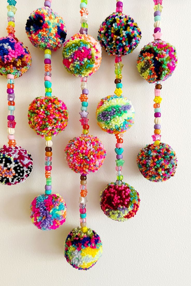 there are many beads hanging on the wall