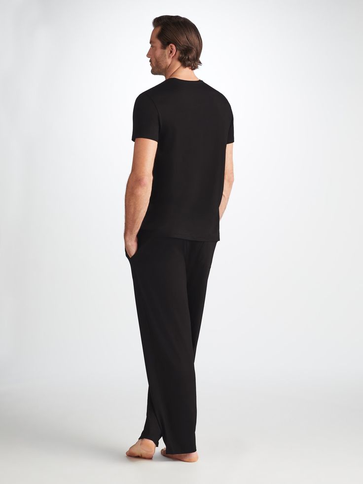 The ideal loungewear companion, the black trouser fastens with an elastic and tie waistband for a winning combination of comfort and flattering fit. The two front side pockets and a rear back pocket help to keep your phone and essentials close while you're lounging, while the black colour makes them easy to pair with our matching lounge t-shirts and hoodies. Our Basel fabric has to be touched to be believed. It offers long-lasting softness and doesn't pill, making it able to withstand countless Black Relaxed Fit Sweatpants For Relaxation, Casual Black Sweatpants For Relaxation, Black Casual Sweatpants, Black Relaxed Fit Casual Pants, Black Relaxed Fit Pants For Relaxation, Black Sweatpants With Elastic Waistband For Loungewear, Black Relaxed Fit Joggers For Lounging, Black Pants With Straight Hem For Loungewear, Black Joggers With Pockets For Lounging